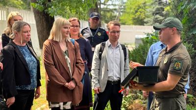 Representatives of Moldovan authorities, the OSCE and the United Kingdom examine aviation security equipment at Chișinău International Airport.